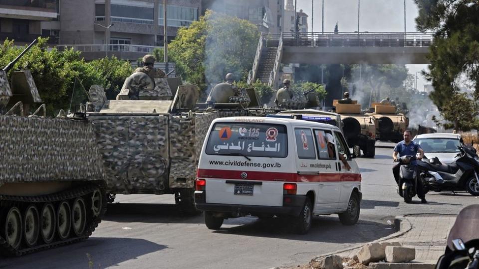 Lebanese army armoured personnel carriers and ambulances near the Palace of Justice in Beirut, Lebanon (14 October 2021)