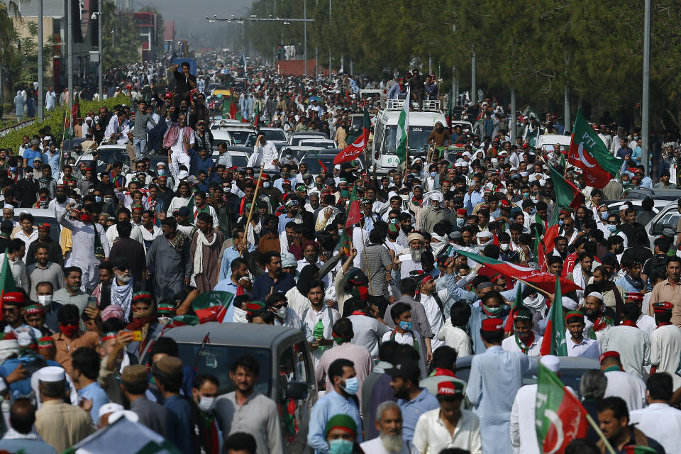 Supporters of Pakistan’s defiant former Prime Minister Imran Khan take part in an anti-government rally near parliament in Islamabad, Pakistan, Thursday, May 26, 2022. Khan early Thursday warned Pakistan's government to set new elections in the next six days or he will again march on the capital along with 3 million people. (AP Photo/Anjum Naveed)