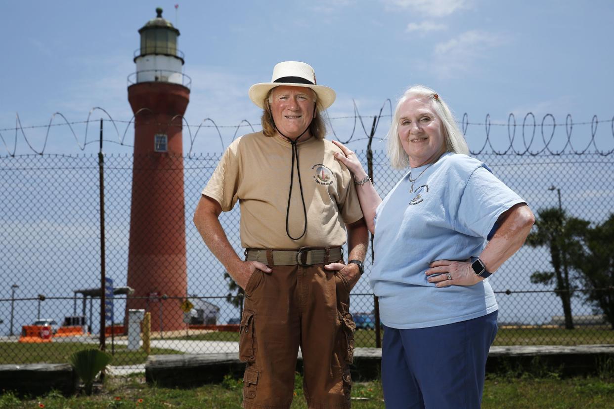 Dan Hogan, president of the Mayport Lighthouse Association, and Beverly Oakes, the organization's vice president, stand outside the historic St. Johns River Lighthouse. The group, affiliated with the Florida Lighthouse Association, advocates for the 1859 lighthouse, which sits at the edge of Mayport Village but inside the perimeter fence of the naval station.