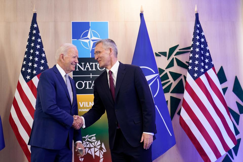 U.S. President Joe Biden, left, shake hands with NATO Secretary General Jens Stoltenberg as they meet at the NATO summit in Vilnius, Lithuania, Tuesday, July 11, 2023.