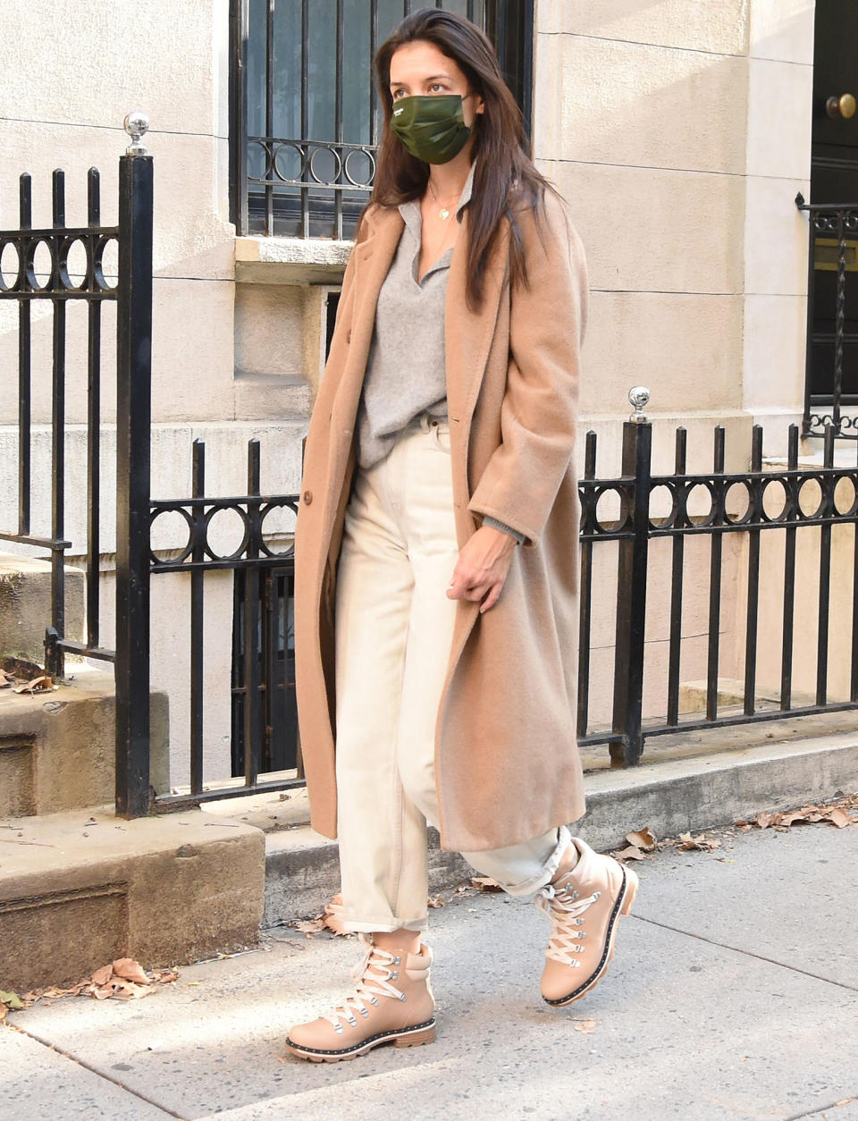 <p>Katie Holmes pairs a chic ankle-length coat with SOREL boots as she heads out in N.Y.C. on Thursday. </p>