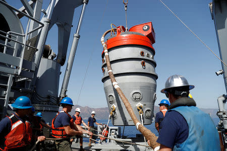 U.S. sailors prepare a U.S. Navy Submarine Rescue Chamber to dive on board the Turkish Navy's submarine rescue mother ship TCG Alemdar during the Dynamic Monarch-17, a NATO-sponsored submarine escape and rescue exercise, off the Turkish Naval base of Aksaz, Turkey, September 20, 2017. Picture taken September 20, 2017. REUTERS/Murad Sezer