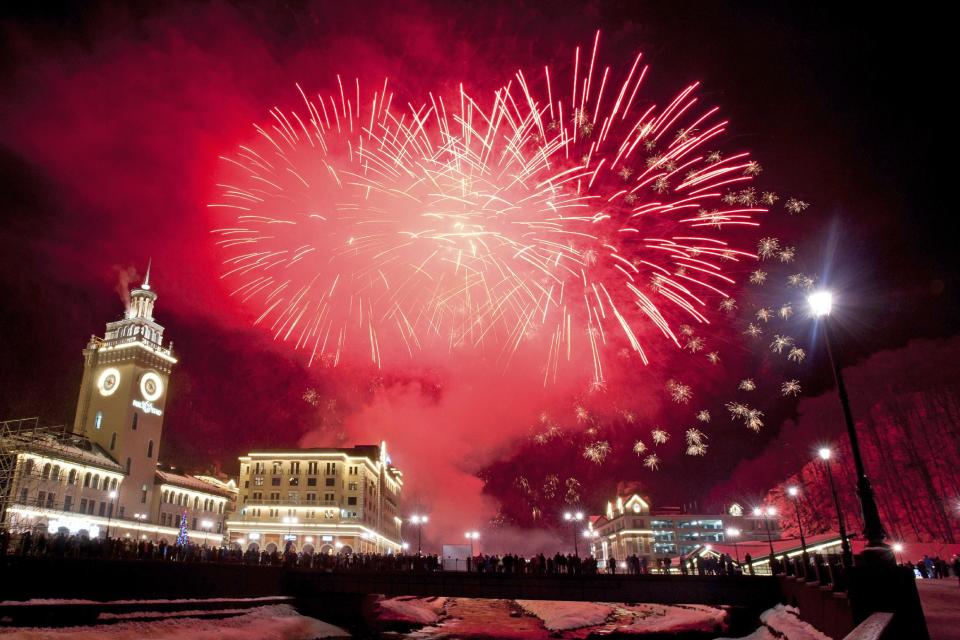 Fireworks explode above the central square of Rosa Khutor ski resort, a venue of the 2014 Winter Olympics, in Krasnaya Polyana, 60 kilometers (37.5 miles) east of Sochi, Russia during New Year's celebrations early Wednesday, Jan. 1, 2014. (AP Photo/Lesya Polyakova)