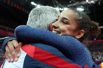 Aly Raisman embraces her coach after winning bronze on her appeal. (Reuters)