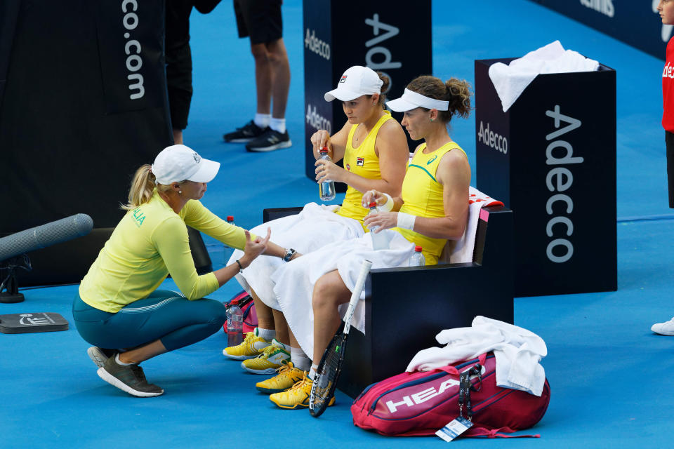 Australian captain Alicia Molik urges her players Ash Barty and Sam Stosur during a points break during their Fed Cup tennis final in Perth, Australia, Sunday, Nov. 10, 2019. (AP Photo/Trevor Collens)