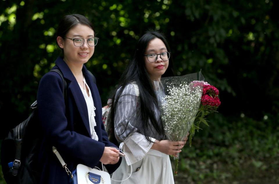 Students and film fans Yunyao Li, 23 (left) and Qiong dan Xu, 24, from Glasgow, at Wardhill Castle in Aberdeenshire (PA)