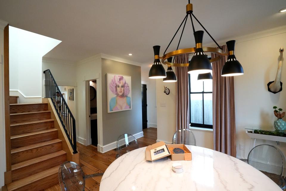 The home of Seth Whitlow and Todd Barrett contains many pieces of art, including a portrait of drag queen Nina West.