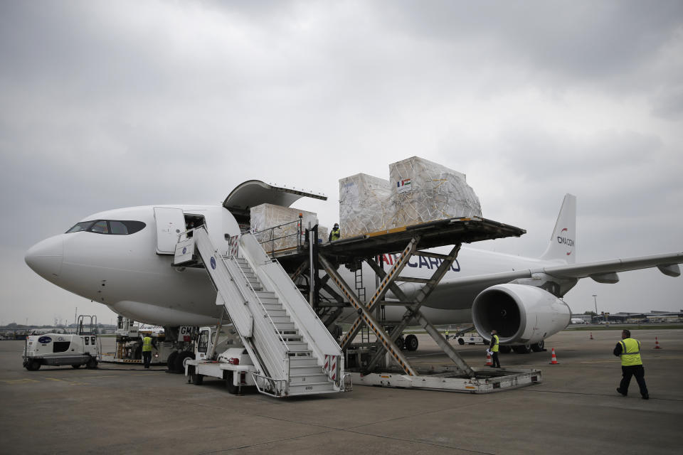 Medical supplies and relied materials are loaded into a cargo plane to India at Roissy airport, north of Paris, Saturday, May 1, 2021. France sends oxygen respiratory equipment and generators to India to help the country deal with the serious COVID-19 crisis. (AP Photo/Lewis Joly, Pool)