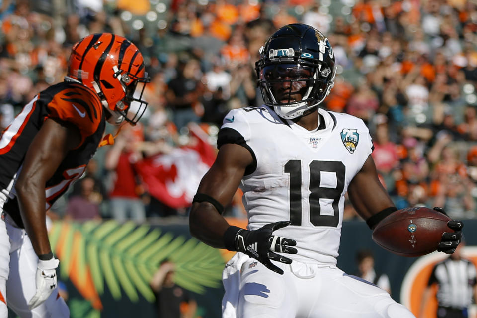 FILE - In this Oct. 20, 2019, file file photo, Jacksonville Jaguars wide receiver Chris Conley (18) scores a 2-point conversation in the second half of the team's NFL football game against the Cincinnati Bengals in Cincinnati. Conley called on “figures who are the face of the league” to do more to help fight social injustice. The sixth-year pro made it clear Thursday, Aug. 27, he was talking about the NFL’s top quarterbacks, the ones who have the most influence in games, in locker rooms and in communities. Think Tom Brady, Drew Brees, Patrick Mahomes, Deshaun Watson, Russell Wilson and Lamar Jackson, for starters. (AP Photo/Frank Victores, File)