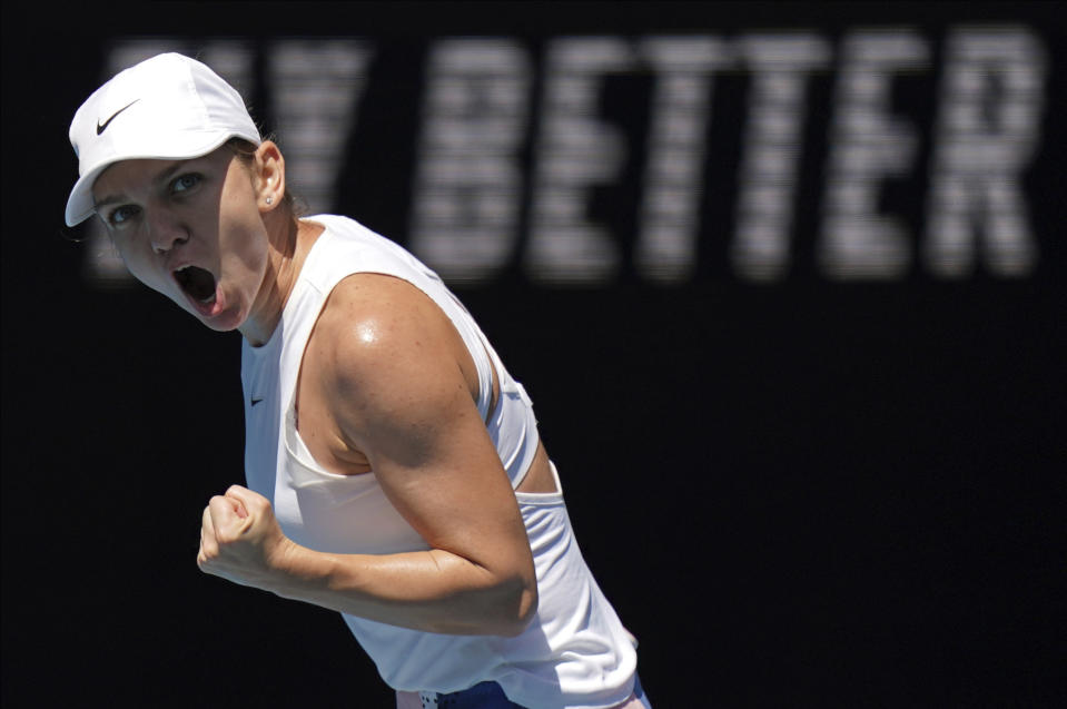 FILE - In this Wednesday, Jan. 29, 2020, file photo, Romania's Simona Halep reacts after winning a point against Estonia's Anett Kontaveit during their quarterfinal match at the Australian Open tennis championship in Melbourne, Australia. Halep is expected to compete in the French Open that begins Sunday, Sept. 27. (AP Photo/Lee Jin-man)