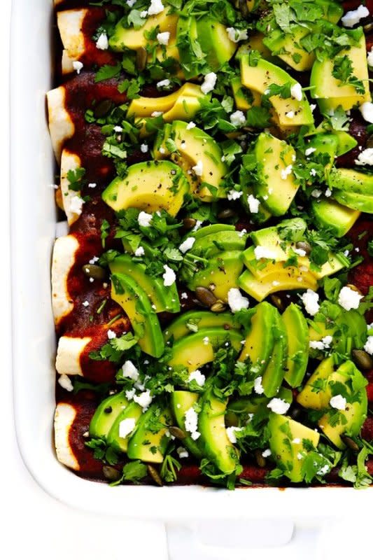 <p>Gimme Some Oven</p><p>These Roasted Cauliflower Enchiladas are super hearty and flavorful, made with a homemade enchilada sauce, and deliciously vegetarian (or they can be made vegan if you prefer). Get the recipe for <strong><a href="https://www.gimmesomeoven.com/roasted-cauliflower-enchiladas/" rel="nofollow noopener" target="_blank" data-ylk="slk:Roasted Cauliflower Enchiladas;elm:context_link;itc:0;sec:content-canvas" class="link rapid-noclick-resp">Roasted Cauliflower Enchiladas</a></strong>.</p>