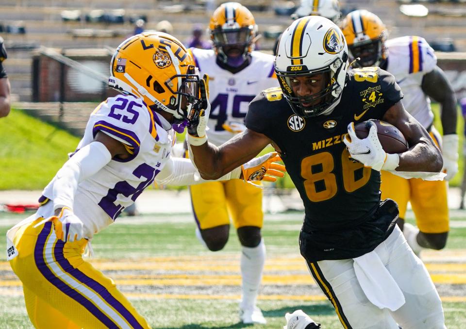 Missouri wide receiver Tauskie Dove (86) runs against LSU cornerback Cordale Flott (25) during a game Oct. 10, 2020, at Faurot Field.