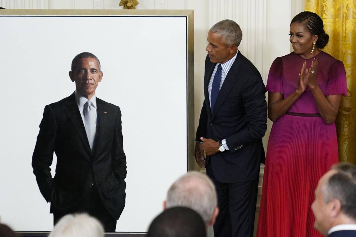 Former President Barack Obama looks at his official White House portrait with former first lady Michelle Obama during a ceremony in the East Room of the White House, Wednesday, Sept. 7, 2022, in Washington. 