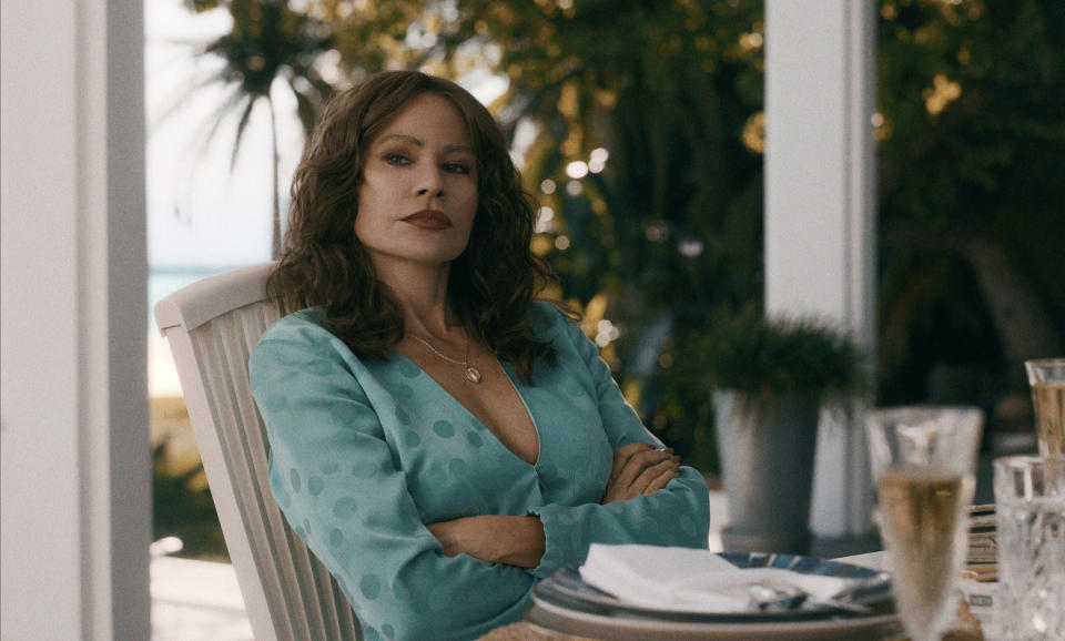 woman sitting at a table with her arms crossed