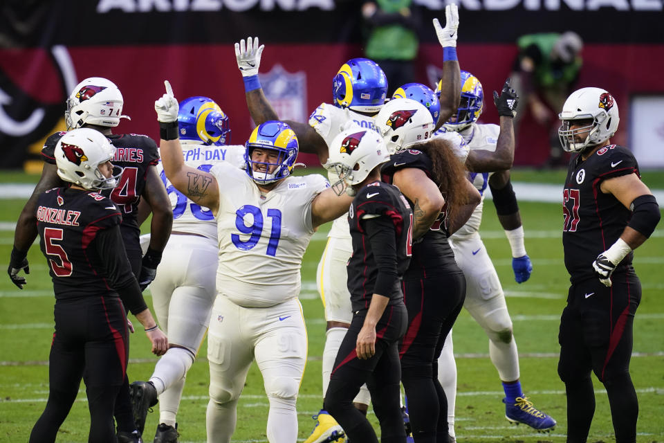 Los Angeles Rams defensive tackle Greg Gaines (91) cheers after Arizona Cardinals kicker Zane Gonzalez (5) missed a field goal during the first half of an NFL football game, Sunday, Dec. 6, 2020, in Glendale, Ariz. (AP Photo/Ross D. Franklin)