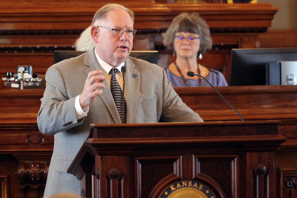 Kansas House Speaker Dan Hawkins, R-Wichita, speaks in favor of a bill that would restrict diversity, equity and inclusion initiatives on university campuses during a debate, Wednesday, March 20, 2024, at the Statehouse in Topeka, Kan. Hawkins and other Republican lawmakers want to prevent universities from basing student admission or employee hiring or promotion decisions based on statements they would require from the candidates about their views on DEI initiatives. (AP Photo/John Hanna)