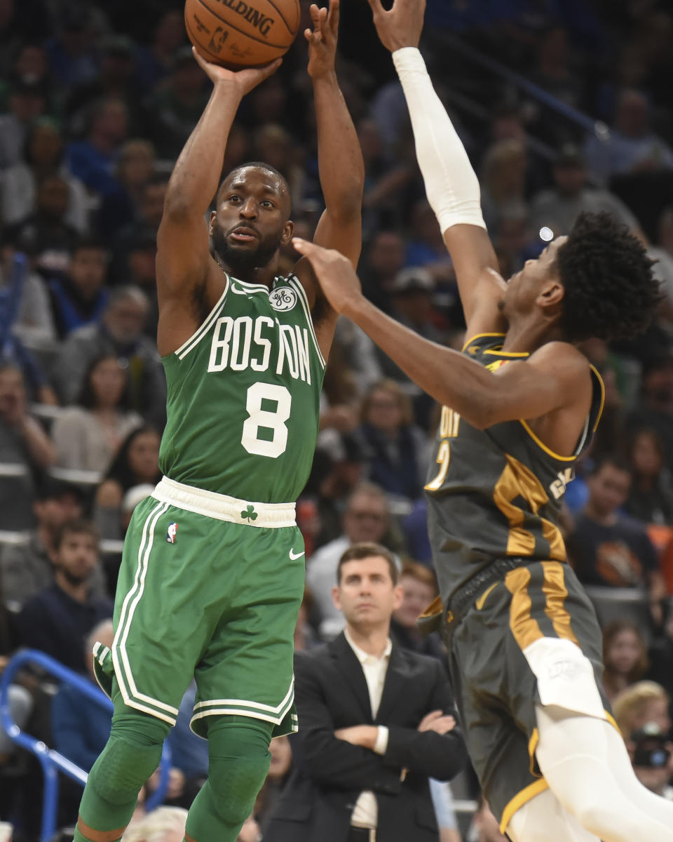 Boston Celtics Kemba Walker (8) shoots over Oklahoma City Thunder guard Shai Gilgeous-Alexander (2) in the second half of an NBA basketball game, Sunday, Feb. 9, 2020, in Oklahoma City. (AP Photo/Kyle Phillips)