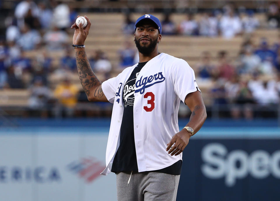 LOS ANGELES, CALIFORNIA - AUGUST 20: Professional basketball player Anthony Davis of the Los Angeles Lakers throws out the ceremonial first pitch prior to the MLB game between the Toronto Blue Jays and the Los Angeles Dodgers at Dodger Stadium on August 20, 2019 in Los Angeles, California. The Dodgers defeated the Blue Jays 16-3.  (Photo by Victor Decolongon/Getty Images)