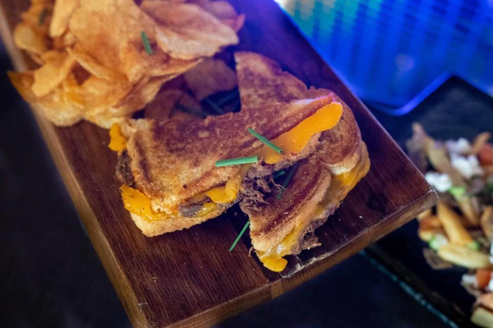 Centro Cocina Mexicana’s birria grilled cheese served with housemade chips is available at the media food tasting event on Monday.