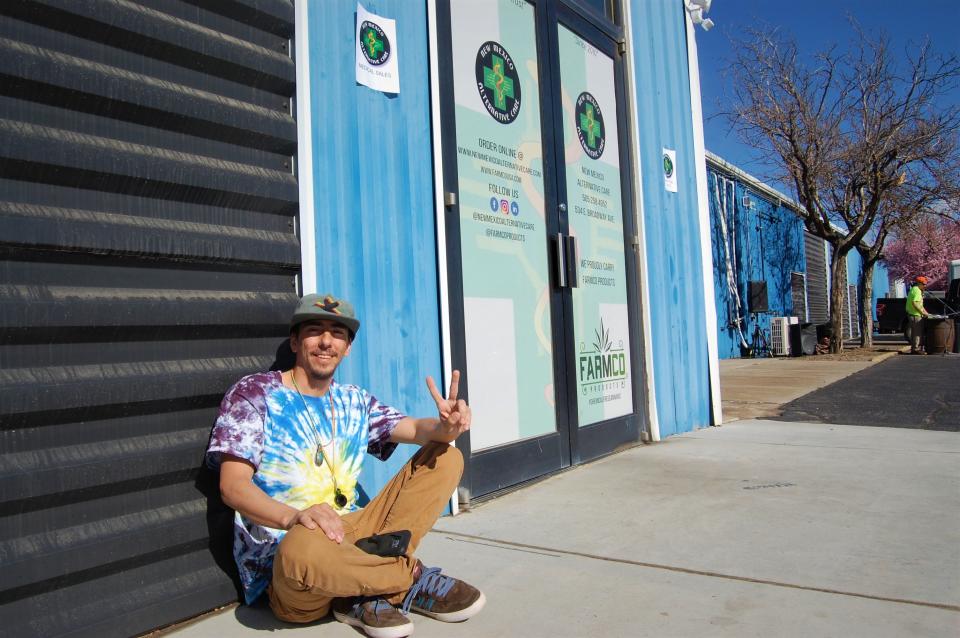 Justin Bryant, of Bloomfield, sits outside Farmington's New Mexico Alternative Care dispensary on the first day of recreation marijuana sales in the state on April 1, 2022.