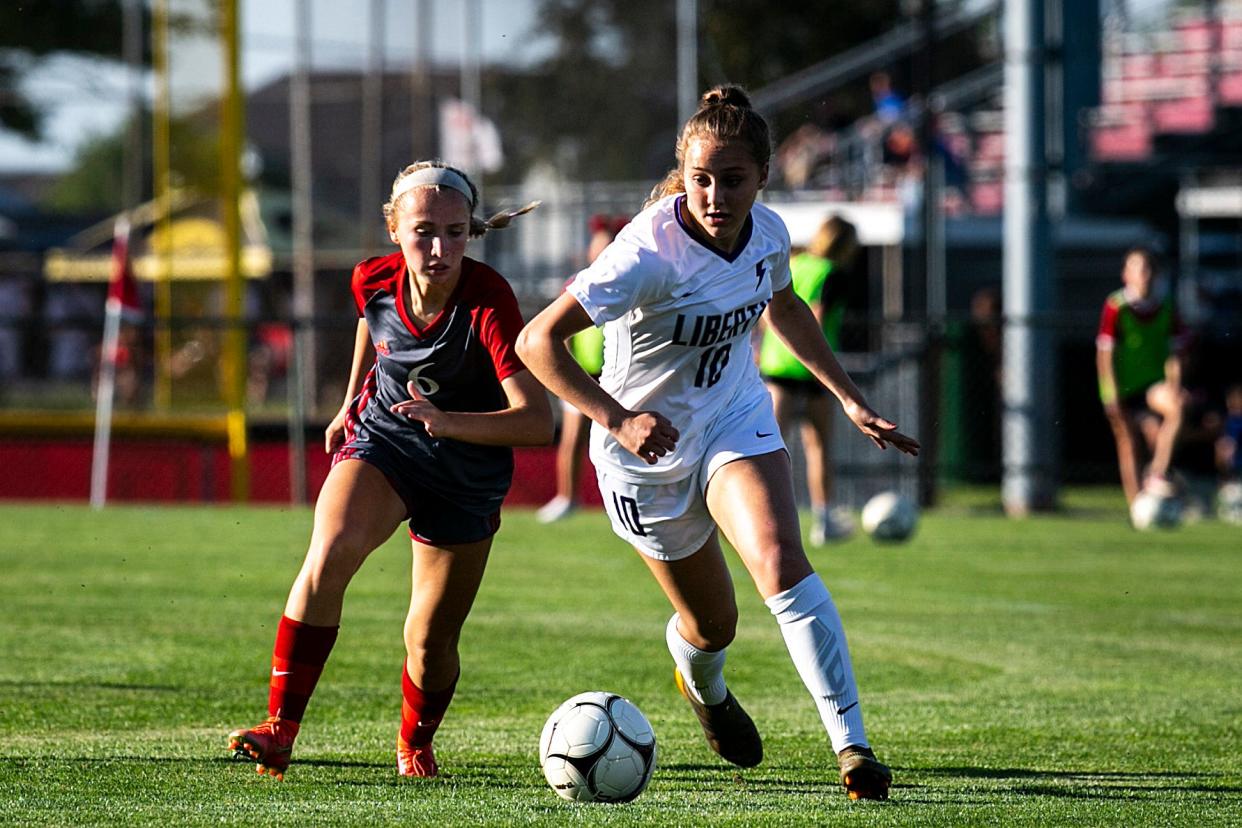 North Scott girls soccer player Reese Hilsenbeck (left), seen here during the 2021 2A regional finals, scored five goals during the Lancers' 11-0 victory over Davenport West April 17 at Eldridge.