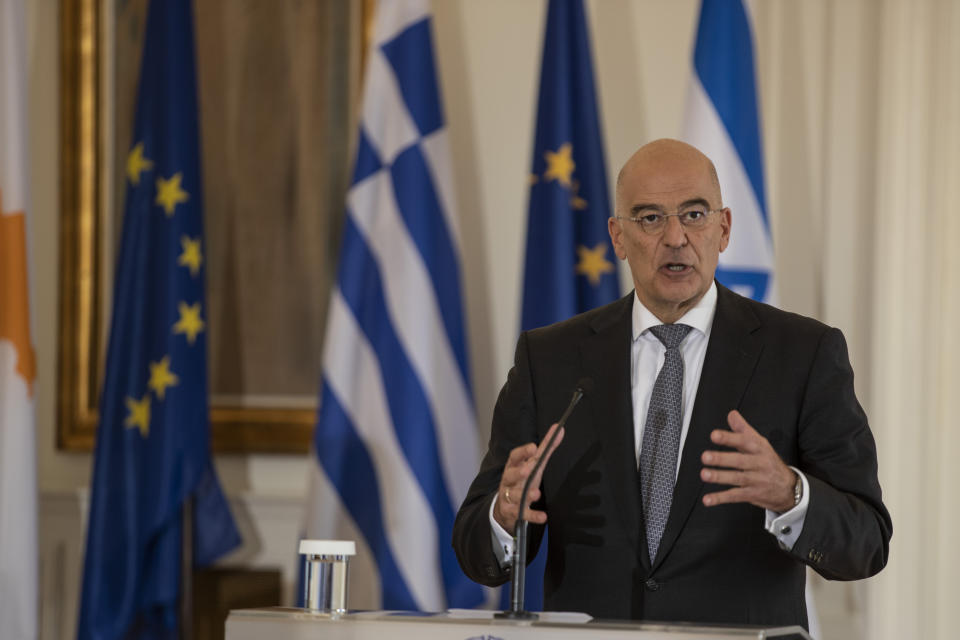 Greek Foreign Minister Nikos Dendias speaks during a join news conference with Israel's counterpart Gabi Ashkenazi and Cypriot Foreign Minister Nikos Christodoulides after a meeting between the foreign Ministers of Greece , Israel and Cyprus in Athens, on Tuesday, Oct. 27, 2020. (AP Photo/Petros Giannakouris)