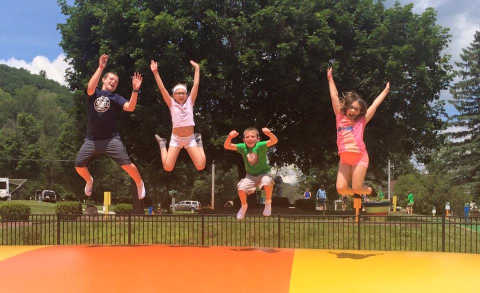 Kids leap into the air at Hickory Hill Camping Resort in the Steuben County town of Bath. Hickory Hill is reopening this year after five years of operating as a KOA Campground.