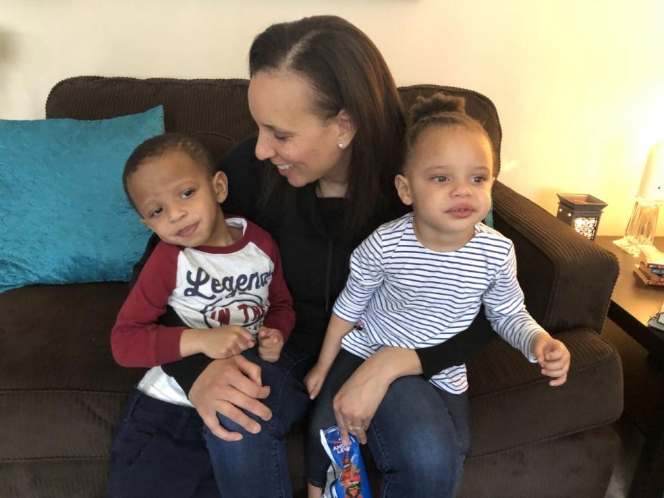 Latrice Knighton, shown with her twins two years ago, is looking forward to family cooking and a take-home meal.