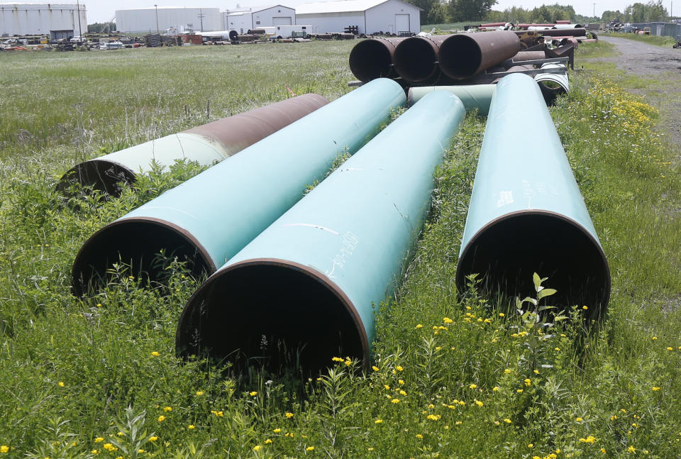 FILE - In this June 29, 2018, file photo, pipeline used to carry crude oil is shown at the Superior, Wis., terminal of Enbridge Energy. The sponsor of the Keystone XL crude oil pipeline says it's pulling the plug on the contentious project, Wednesday, June 9, 2021, after Canadian officials failed to persuade the Biden administration to reverse its cancellation of the company's permit. (AP Photo/Jim Mone, File)