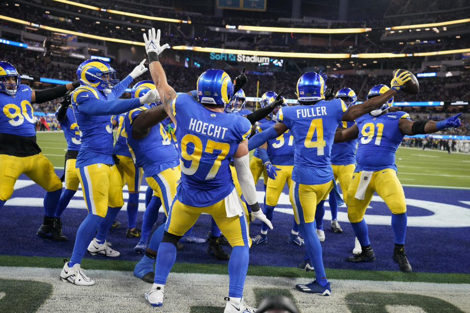 Los Angeles Rams safety Jordan Fuller (4) celebrates with teammates after intercepting a pass against the New Orleans Saints during the second half of an NFL football game Thursday, Dec. 21, 2023, in Inglewood, Calif. (AP Photo/Ashley Landis)