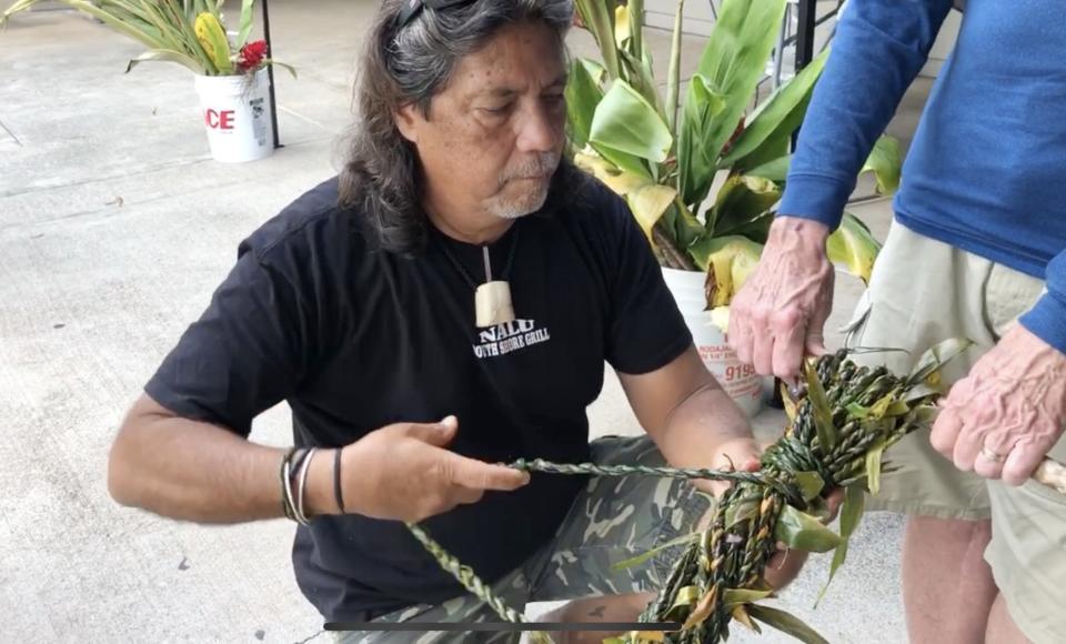 Ron Panzo, a restaurateur in Kihei, Hawaii, works on what will become a mile-long lei destined for the site of a disaster in 2019. Panzo coordinates the Lei of Aloha project, designed to spread the aloha spirit in times of trouble. Calamity struck close to his home last week when fire decimated Lahaina, 23 miles north on Maui.
