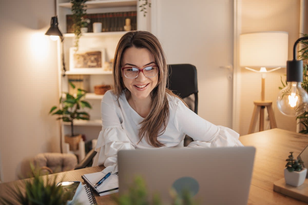 Business young woman works from home from her home office