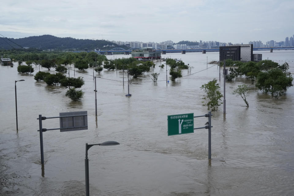 A part of a park along the Han River are flooded due to heavy rain in Seoul, South Korea, Wednesday, Aug. 10, 2022. Cleanup and recovery efforts gained pace in South Korea's greater capital region Wednesday as skies cleared after two days of record-breaking rainfall that unleashed flash floods, damaged thousands of buildings and roads and killed multiple people. (AP Photo/Ahn Young-joon)