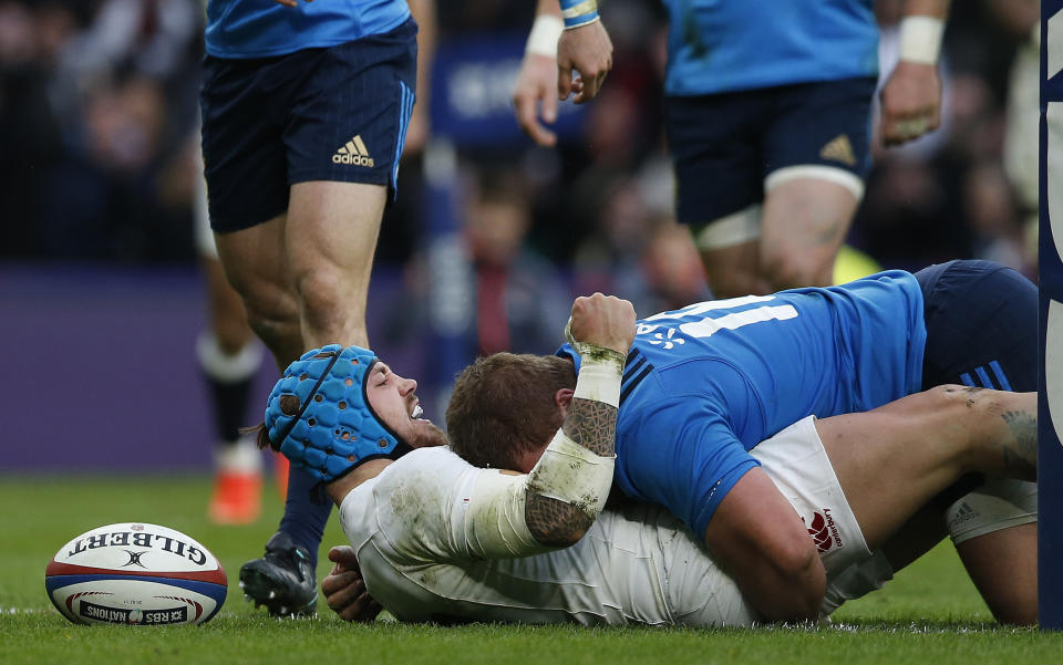 England's Jack Nowell celebrates as he scores a try during the Six Nations rugby union match between England and Italy at Twickenham stadium in London, Sunday, Feb. 26, 2017. (AP Photo/Alastair Grant)