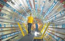 PHYSICS AT WORK: Scientists are seen working on the ATLAS experiment, one of four experiments on the Large Hadron Collider. The Large Hadron Collider is a particle accelerator, 27km long, that straddles the border between France and Switzerland. Picture: CERN