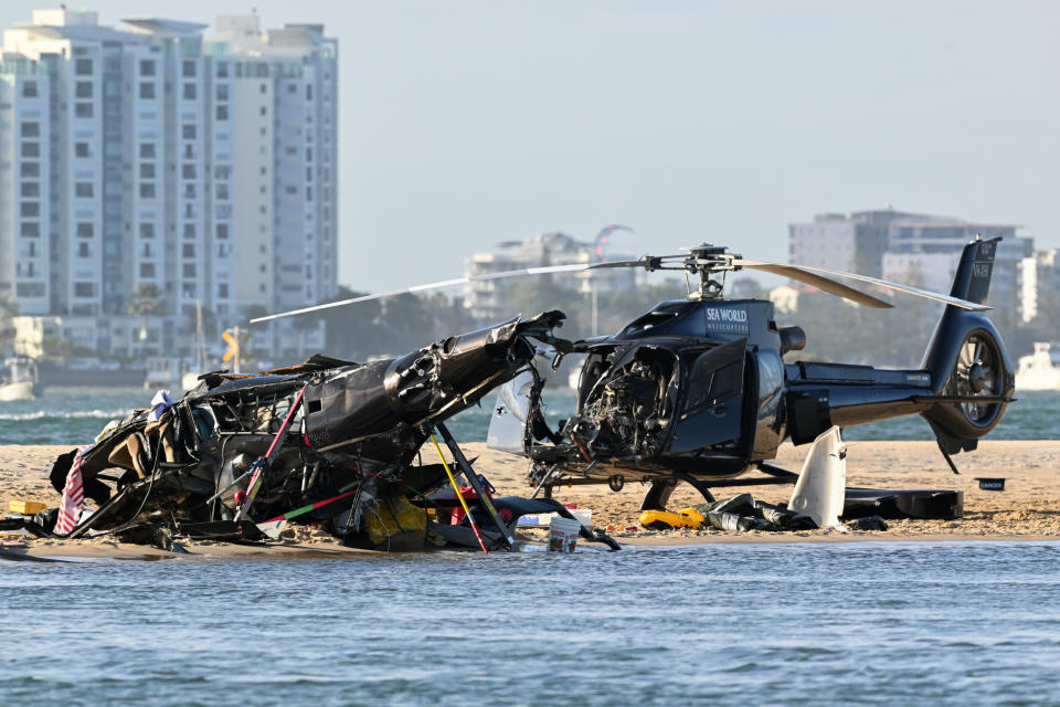 Two helicopters are seen following a collision near Sea World, on the Gold Coast. Source: AAP