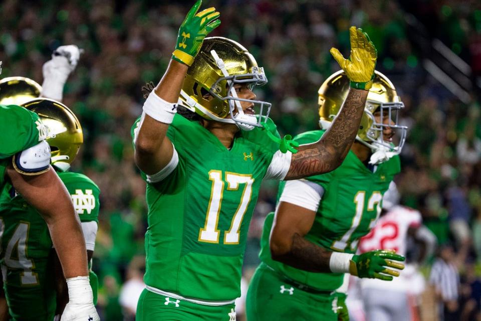 Notre Dame receiver Rico Flores Jr. (17) celebrates a touchdown against Ohio State during the second half of an NCAA college football game against Saturday, Sept. 23, 2023, in South Bend, Ind. (AP Photo/Michael Caterina)