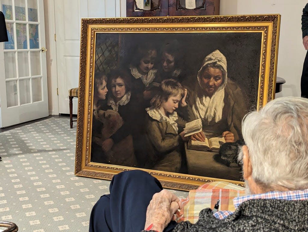 Dr. Francis Wood, 96, admires the John Opie painting, "The Schoolmistress," after the FBI returned to it to him on Jan. 11, 2024.