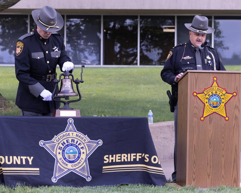 Stark County sheriff's chief deputy John Oliver calls the roll of fallen officers as corrections Sgt. Ryan Hartman rings the bell for each officer at the Stark County Sheriff's Office Peace Officer Memorial Ceremony held Friday at the Stark County Safety Building.