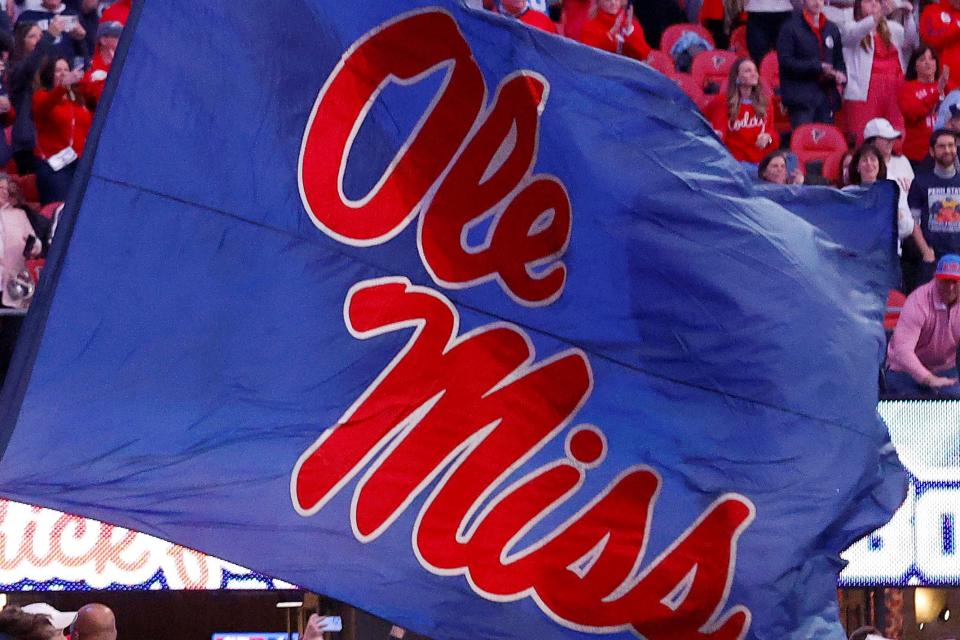 The University of Mississippi flag is waved in December 2023 during the Peach Bowl in Atlanta, Georgia.