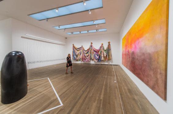 Artworks at the Tate exhibition Soul of a Nation: ‘Self’ by Martin Puryear; ‘Curtain (for William and Peter)’ by Melvin Edwards, 1969-70; ‘Carousel Change’ by Sam Gilliam, 1970; and ‘Texas Louise’ by Frank Bowling, 1971 (Rex)