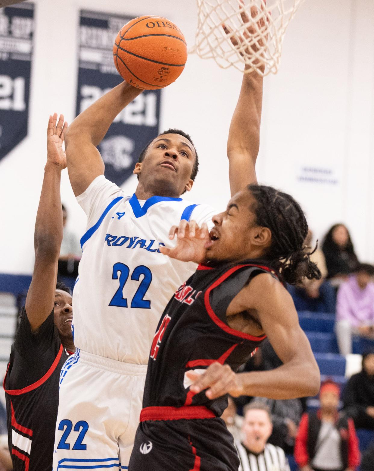 CVCA’s Darryn Peterson goes up to dunk over Shaw’s Hunter Graham during a Division II district semifinal Thursday, March 2, 2023, at Louisville.