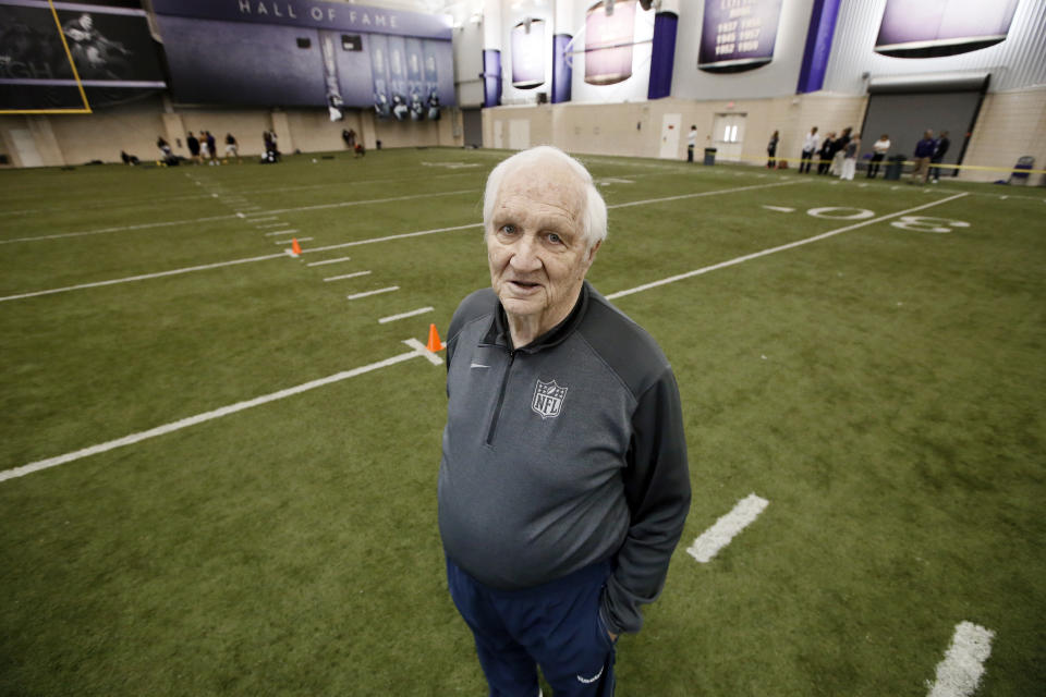 Gil Brandt poses for a photo in the indoor practice facility during TCU NFL football Pro Day Friday, March 27, 2015, in Fort Worth, Texas. (AP Photo/Tony Gutierrez)