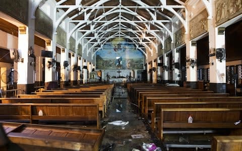 The interior of St Anthony's Shrine five days after a series of bomb blasts targeting churches and luxury hotels on Easter Sunday - Credit: &nbsp;AFP