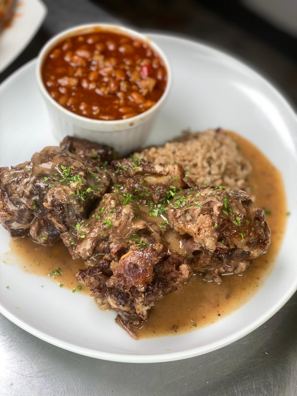 Caribbean Oxtails with Baked Beans at Trap Fusion in Memphis, TN.