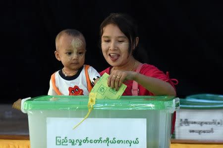 A woman is seen at a polling station while casting her vote in the capital Naypyitaw November 8, 2015. REUTERS/Stringer