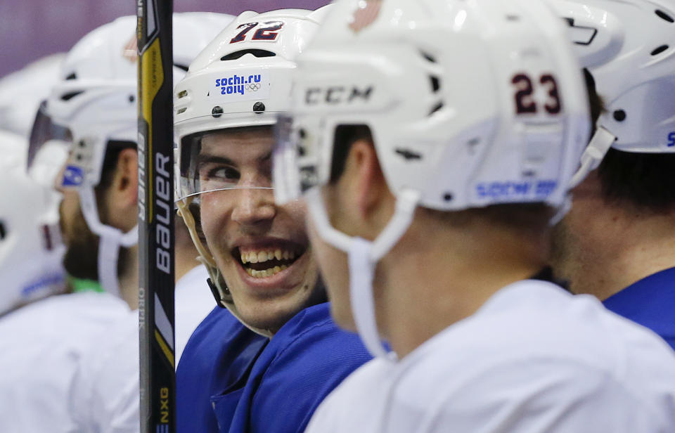 USA defenseman Justin Faulk talks with teammates during a training session at the 2014 Winter Olympics, Monday, Feb. 10, 2014, in Sochi, Russia. (AP Photo/Julie Jacobson)