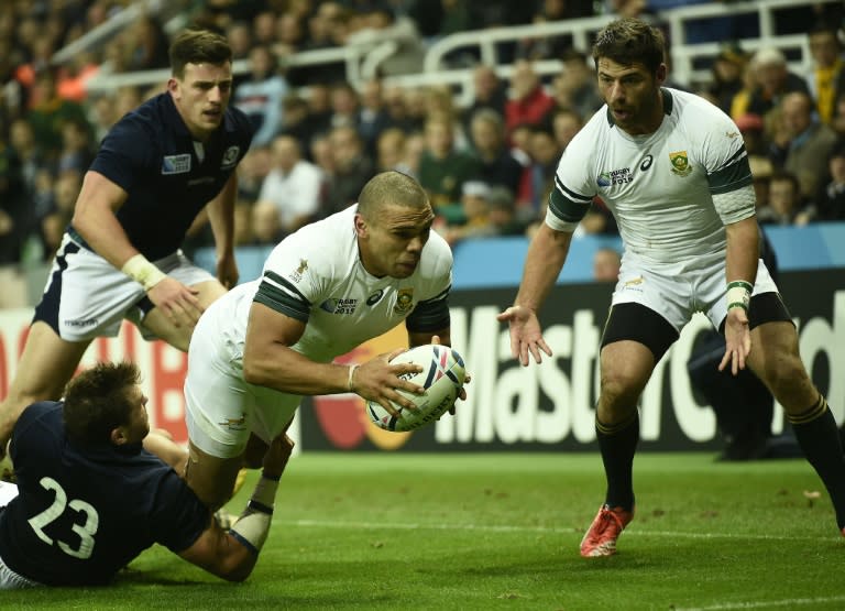 South Africa's wing Bryan Habana (C) scores a try during a Pool B match of the 2015 Rugby World Cup against Scotland at St James' Park in Newcastle-upon-Tyne, north east England on October 3, 2015