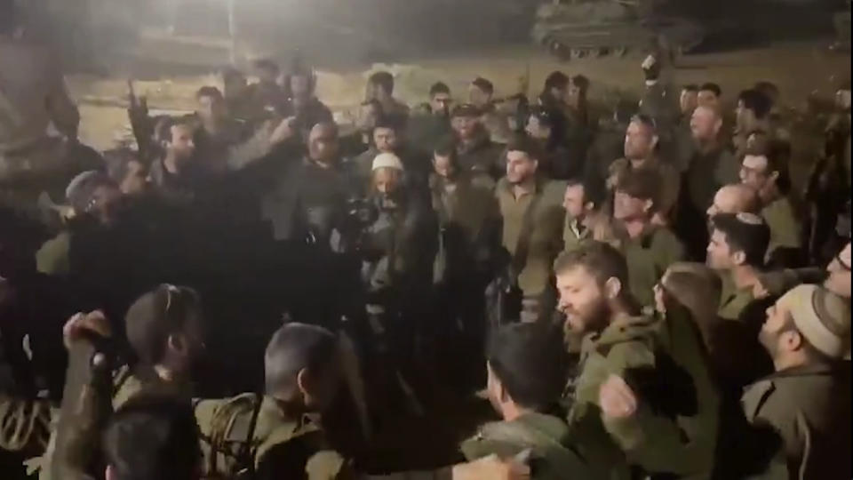 This image made from an undated video shared on X, formerly known as Twitter, shows Israeli Army troops with their arms slung around each other, chanting racist slogans as they dance in a circle, in Gaza. Several viral videos of Israeli soldiers behaving inappropriately in Gaza have emerged in recent days, creating a headache for the Israeli military as it faces an international outcry over its tactics and the rising civilian death toll in its war against Hamas. (X via AP)