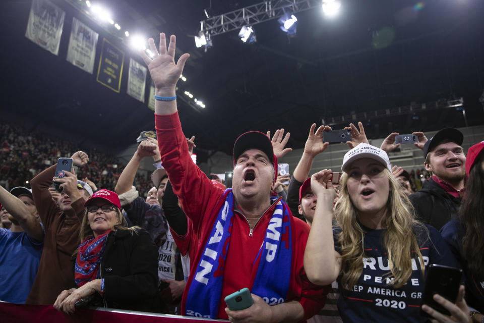 Supporters of President Donald Trump cheer as he arrives for a campaign rally at UW-Milwaukee Panther Arena, Tuesday, Jan. 14, 2020, in Milwaukee. (AP Photo/ Evan Vucci)